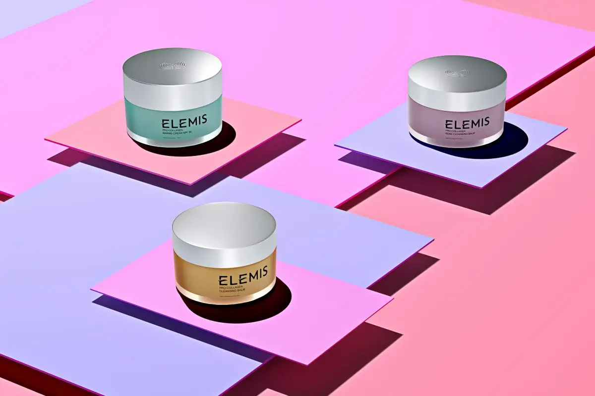 Three Elemis skincare jars styled on pastel geometric platforms for a cosmetics product shoot
