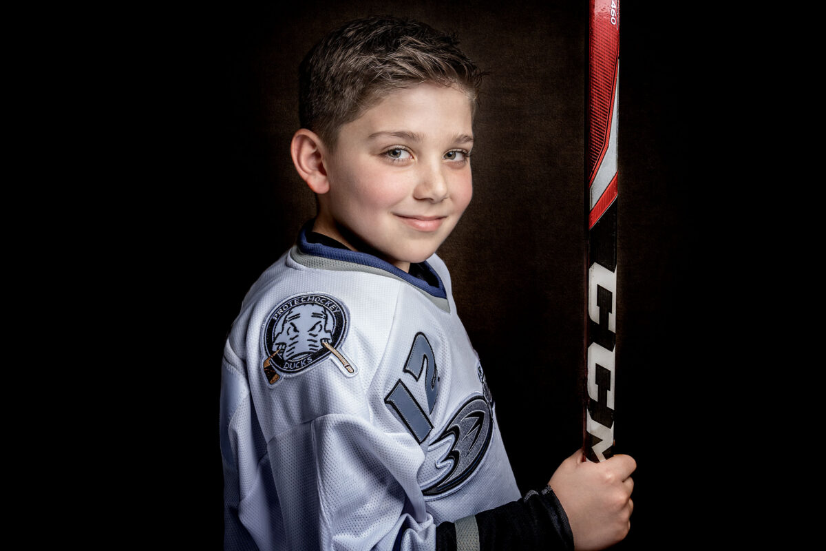 Boy posing for a dramatic studio portrait