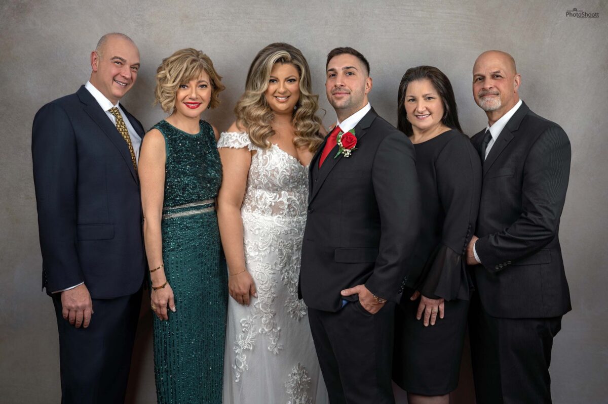 Family group in formal wear at a milestone party