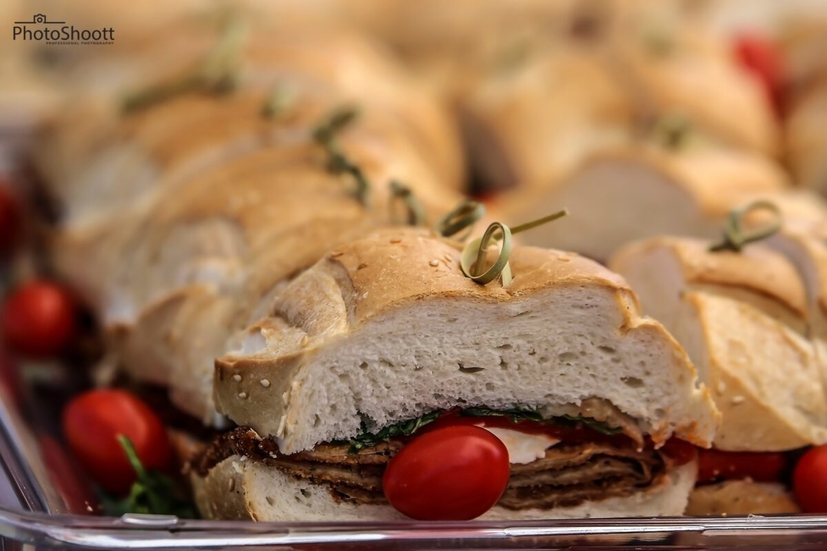 Sliced stuffed bread roll on a wooden board