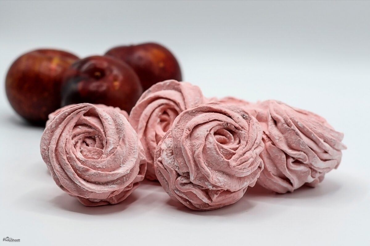 Pink zephyr confections with red apples