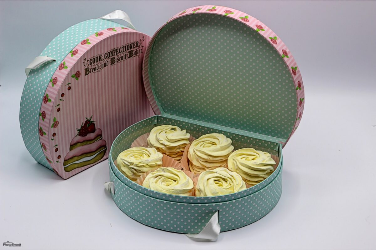 Open gift tin of pastel zephyr confections