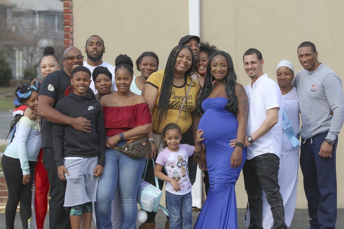 Expectant mother with family and friends at her baby shower