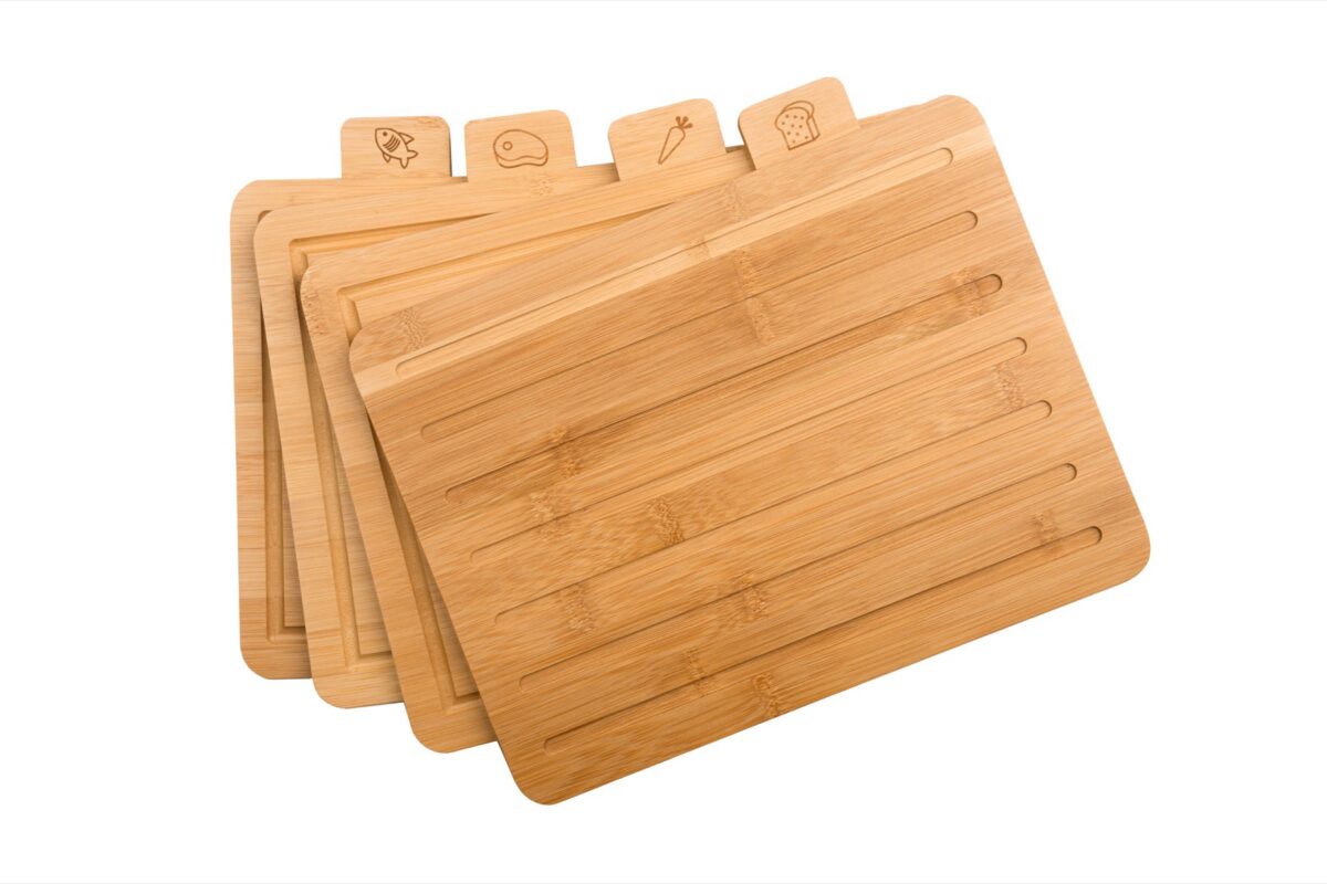 Set of bamboo cutting boards fanned out on a white background