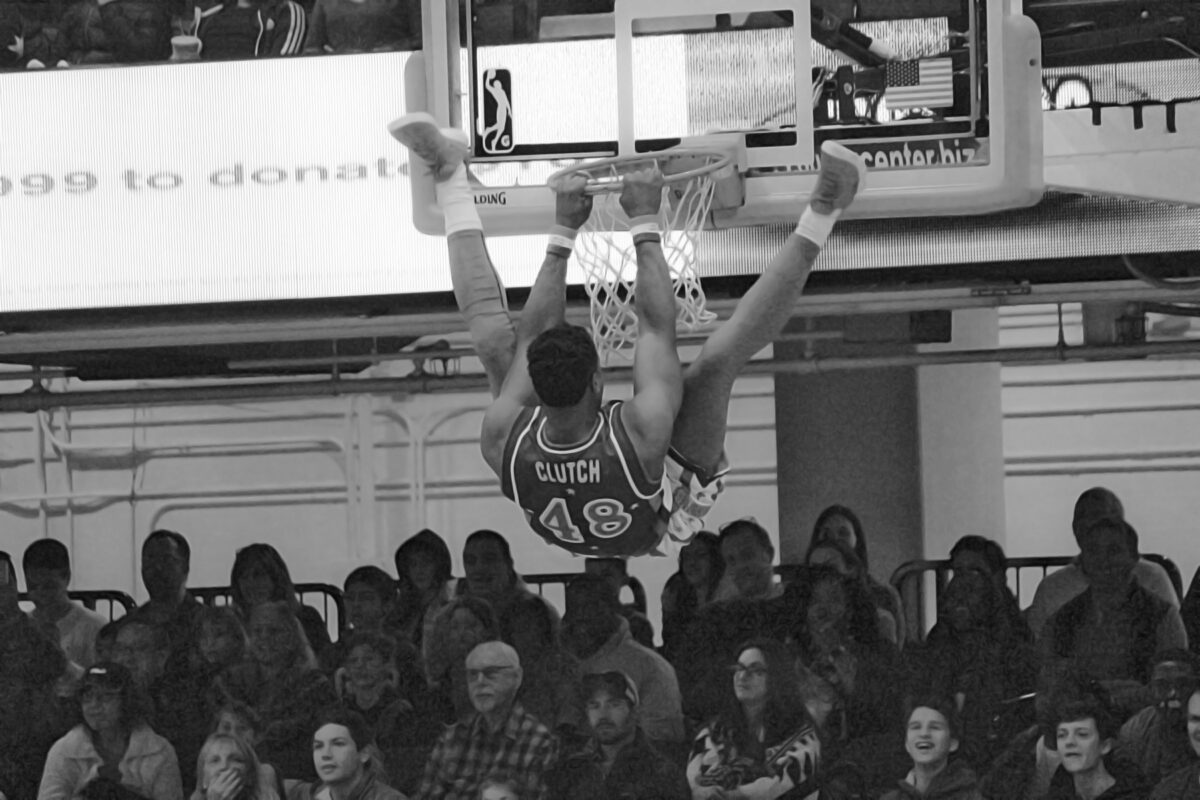 Black and white shot of a Harlem Globetrotters player going for a dunk