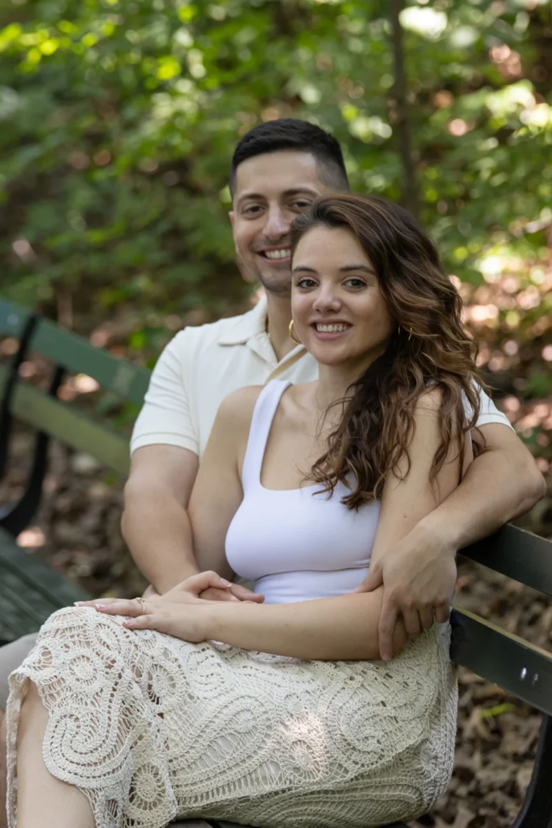 Couple embracing on the rocks during a summer engagement session
