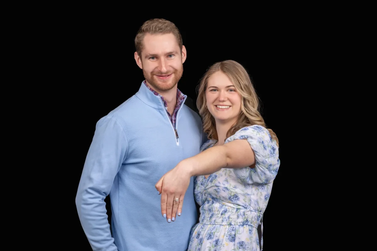 Couple smiling in a studio engagement portrait