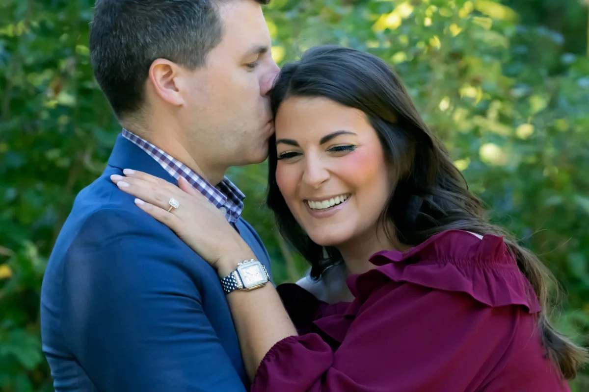 Engaged couple cheek to cheek in a close-up portrait