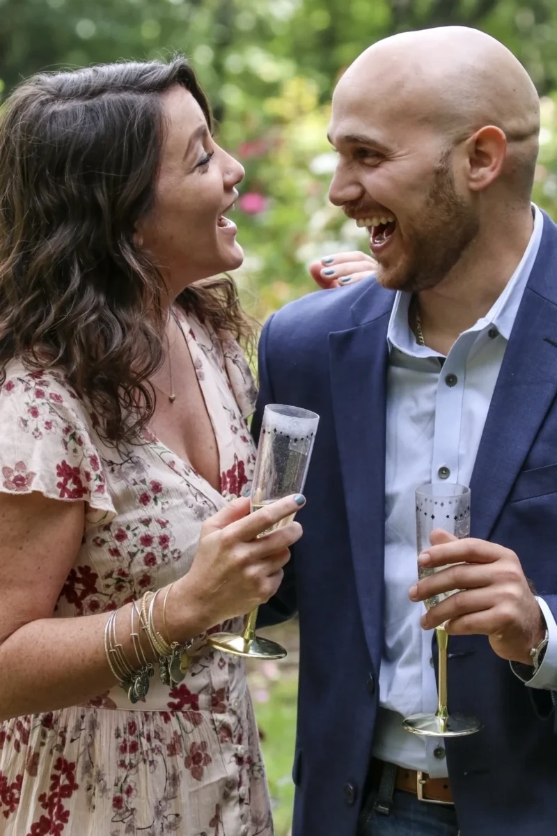 Newly engaged couple smiling together at their engagement party