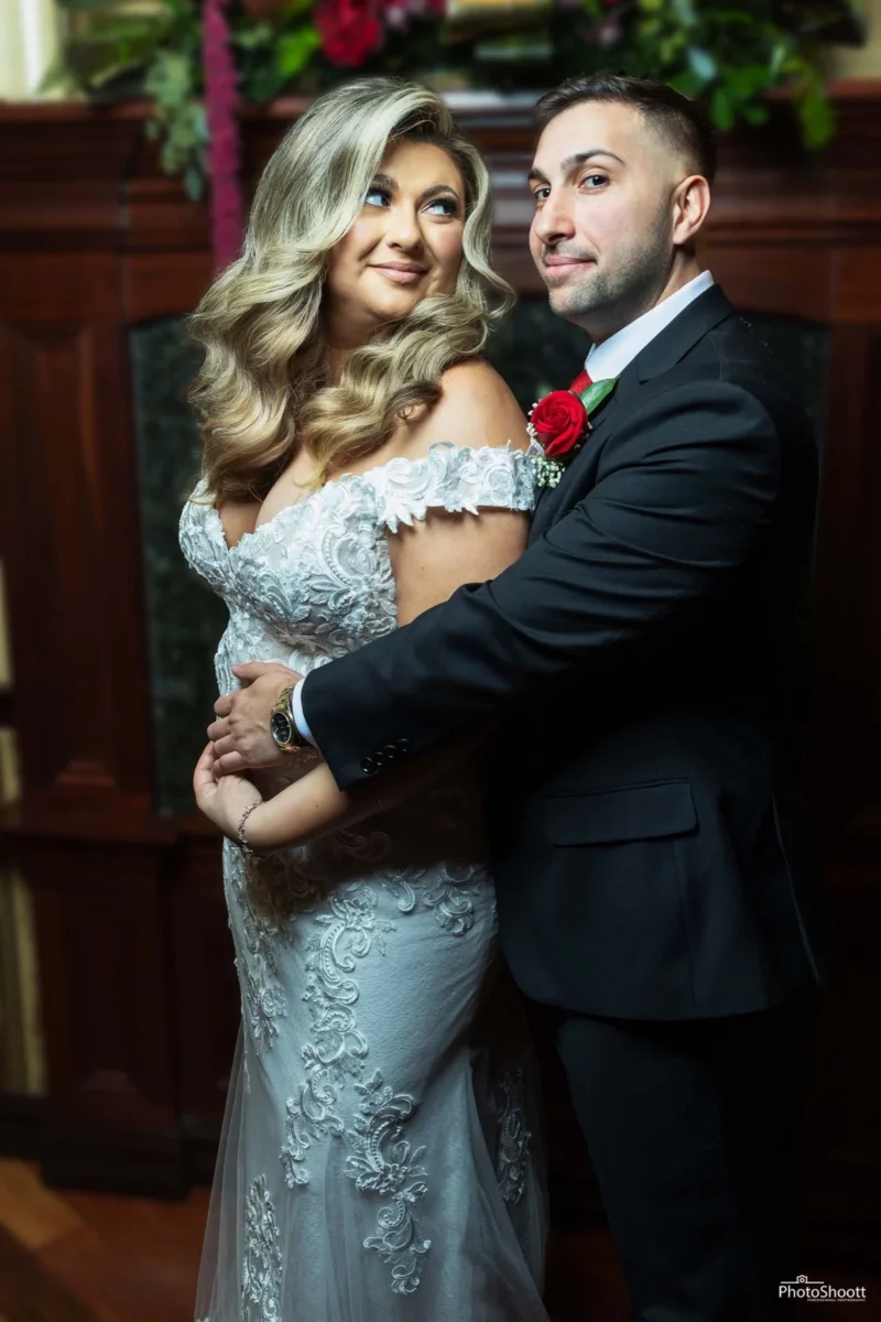 Couple embracing at an evening celebration