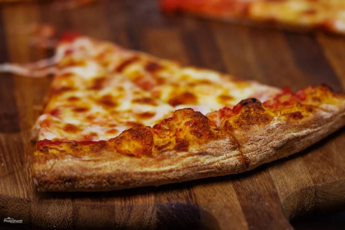 Close-up of a cheese pizza slice