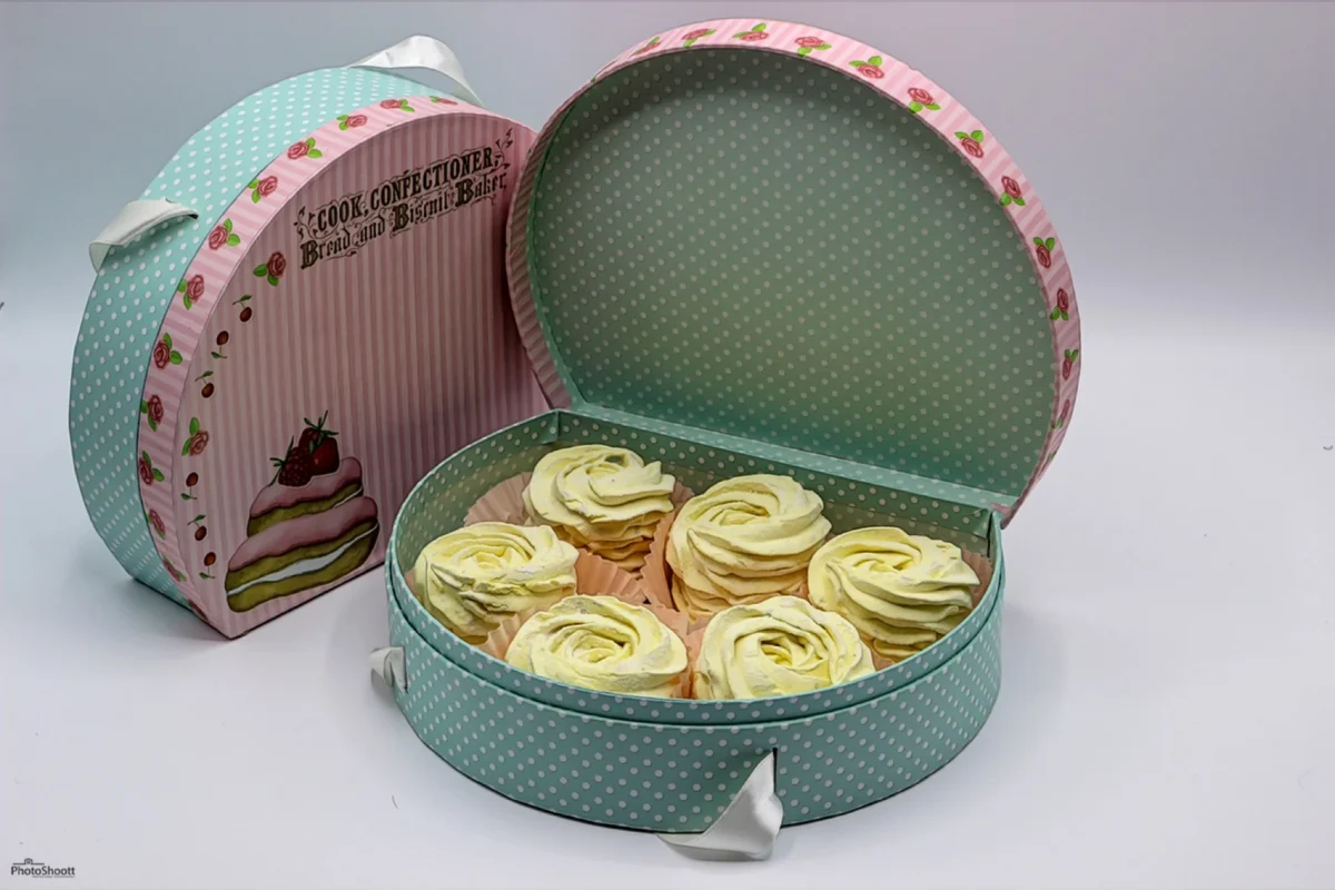 Open gift tin of pastel zephyr confections