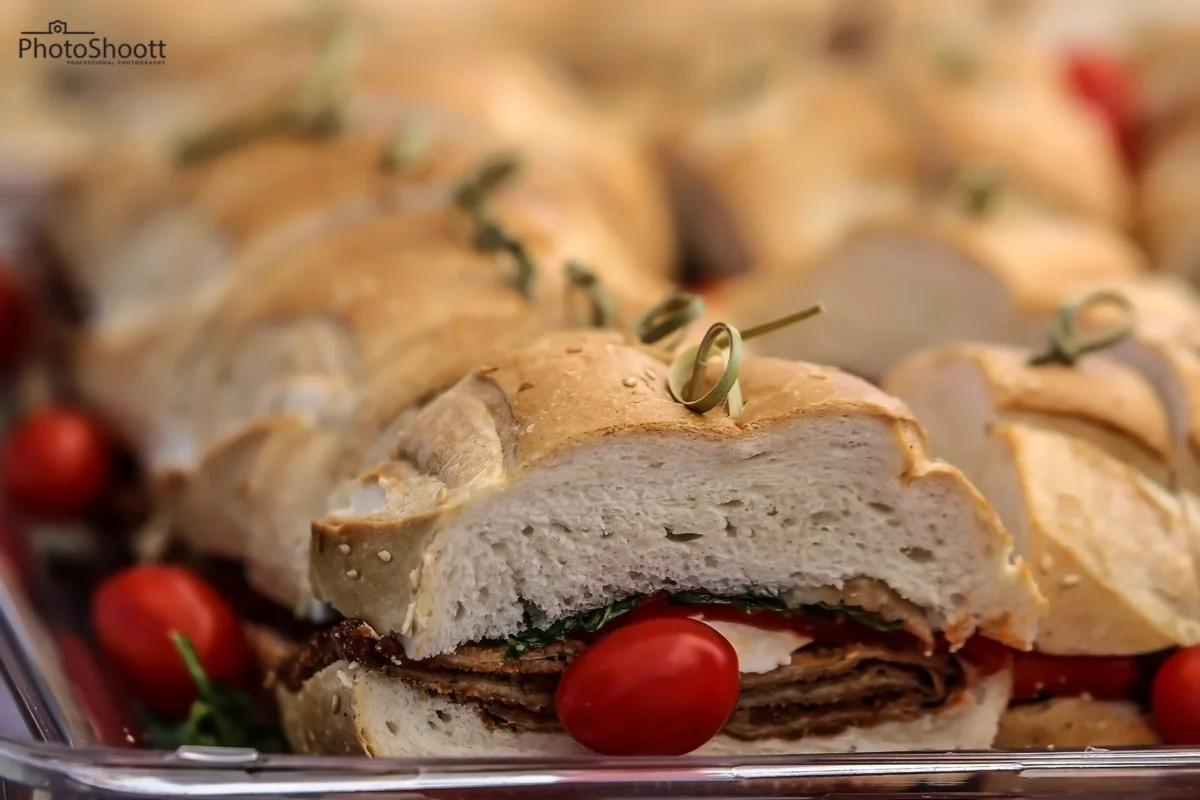 Sliced stuffed bread roll on a wooden board