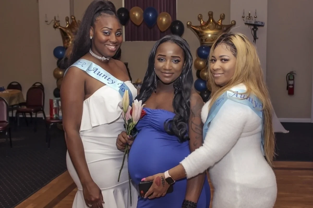 Expectant mother with friends at her baby shower