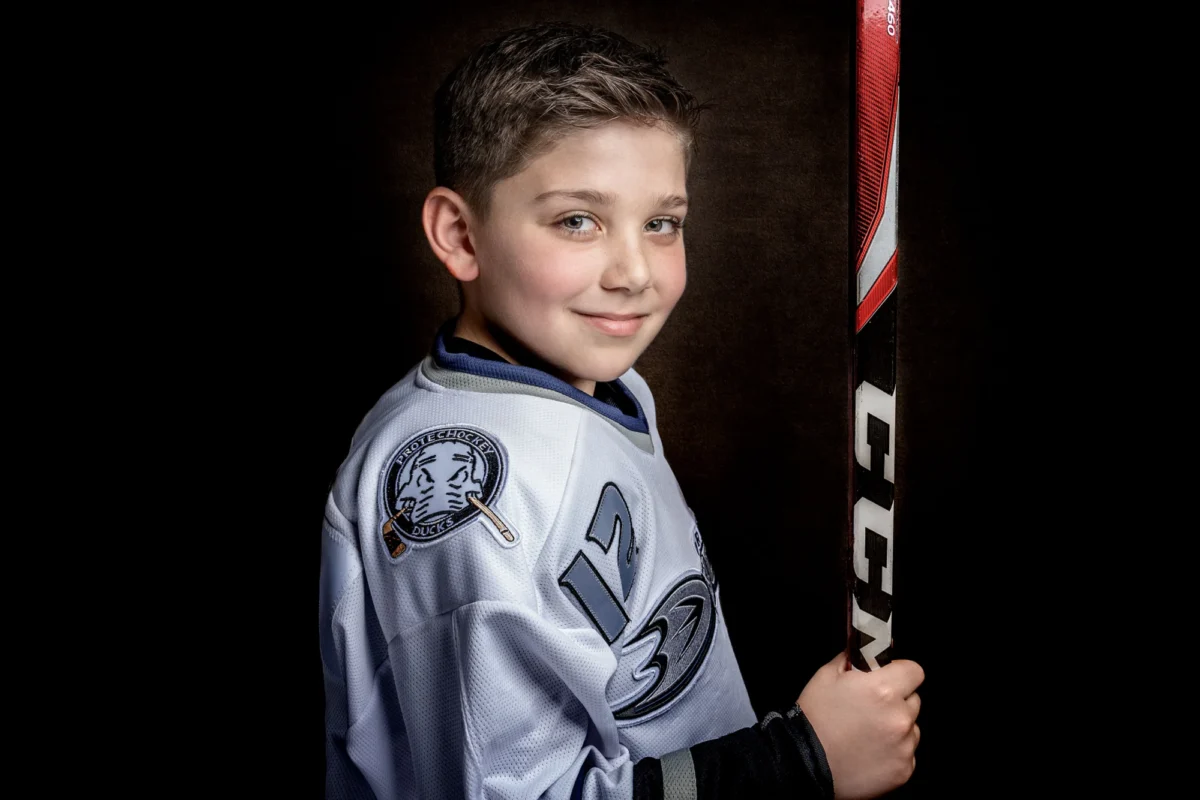 Boy posing for a dramatic studio portrait