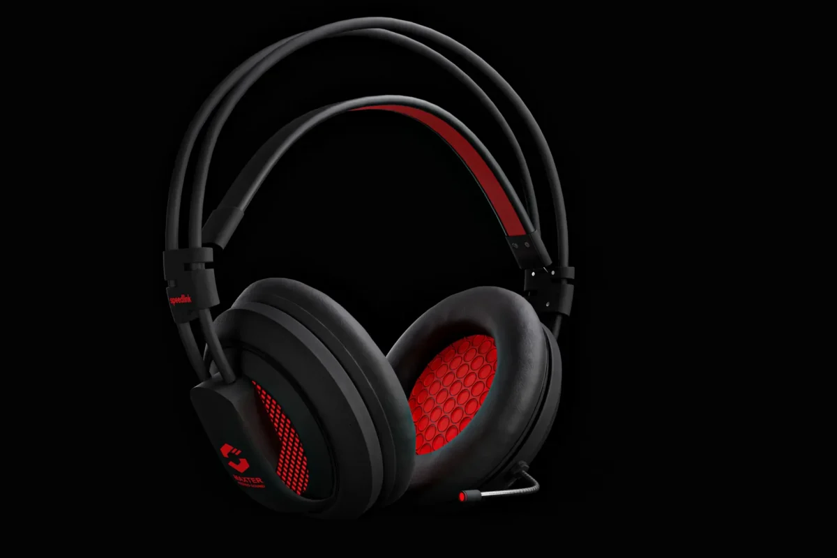 Black and red gaming headset with boom microphone on a dark background