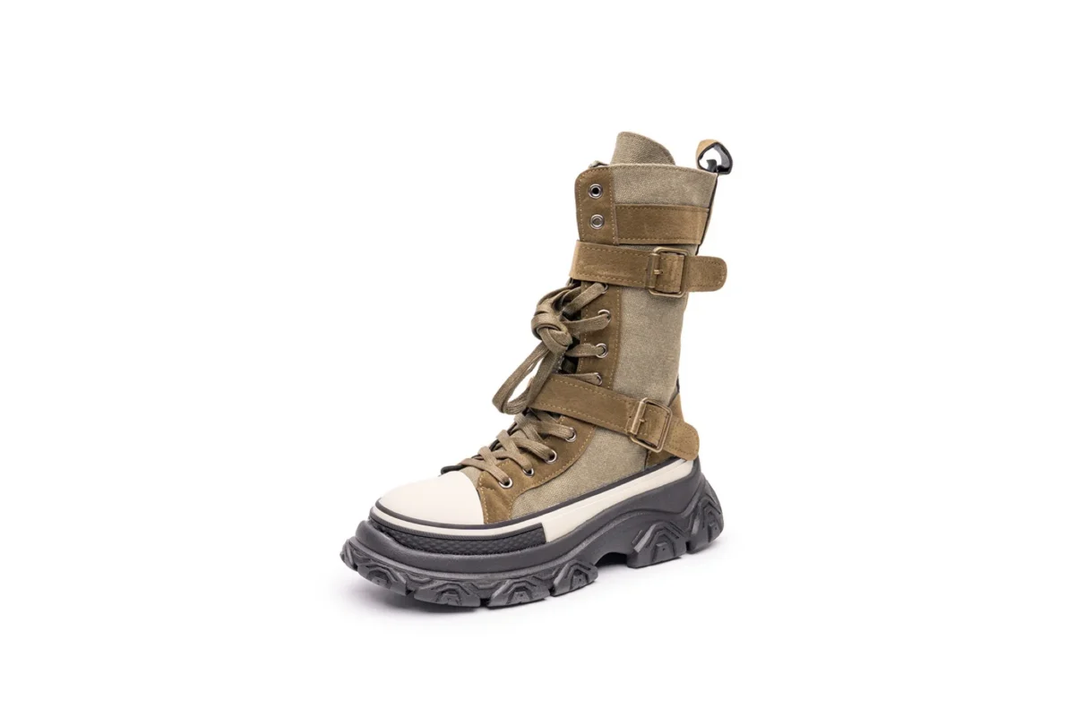 Lace-up combat boot on a white background